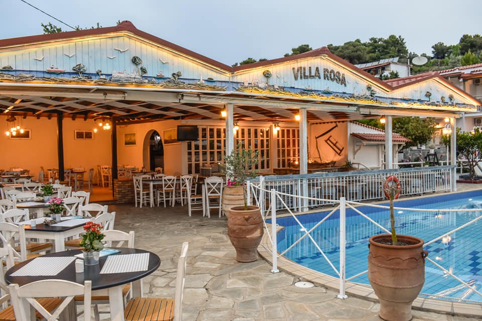 Experience the best Greek night in Skiathos at Villa Rosa! From our Troulos pool bar with sunbeds to an authentic Greek taverna featuring live music, authentic Greek food, and traditional dancing. Book your table for a legendary evening in Troulos.