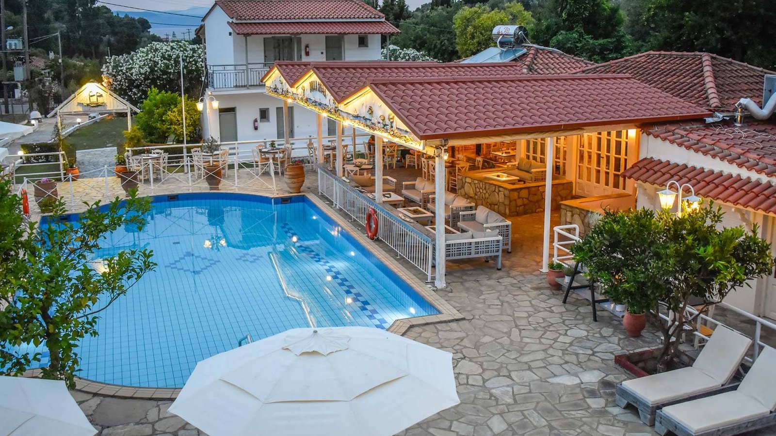 Experience the best Greek night in Skiathos at Villa Rosa! From our Troulos pool bar with sunbeds to an authentic Greek taverna featuring live music, authentic Greek food, and traditional dancing. Book your table for a legendary evening in Troulos.