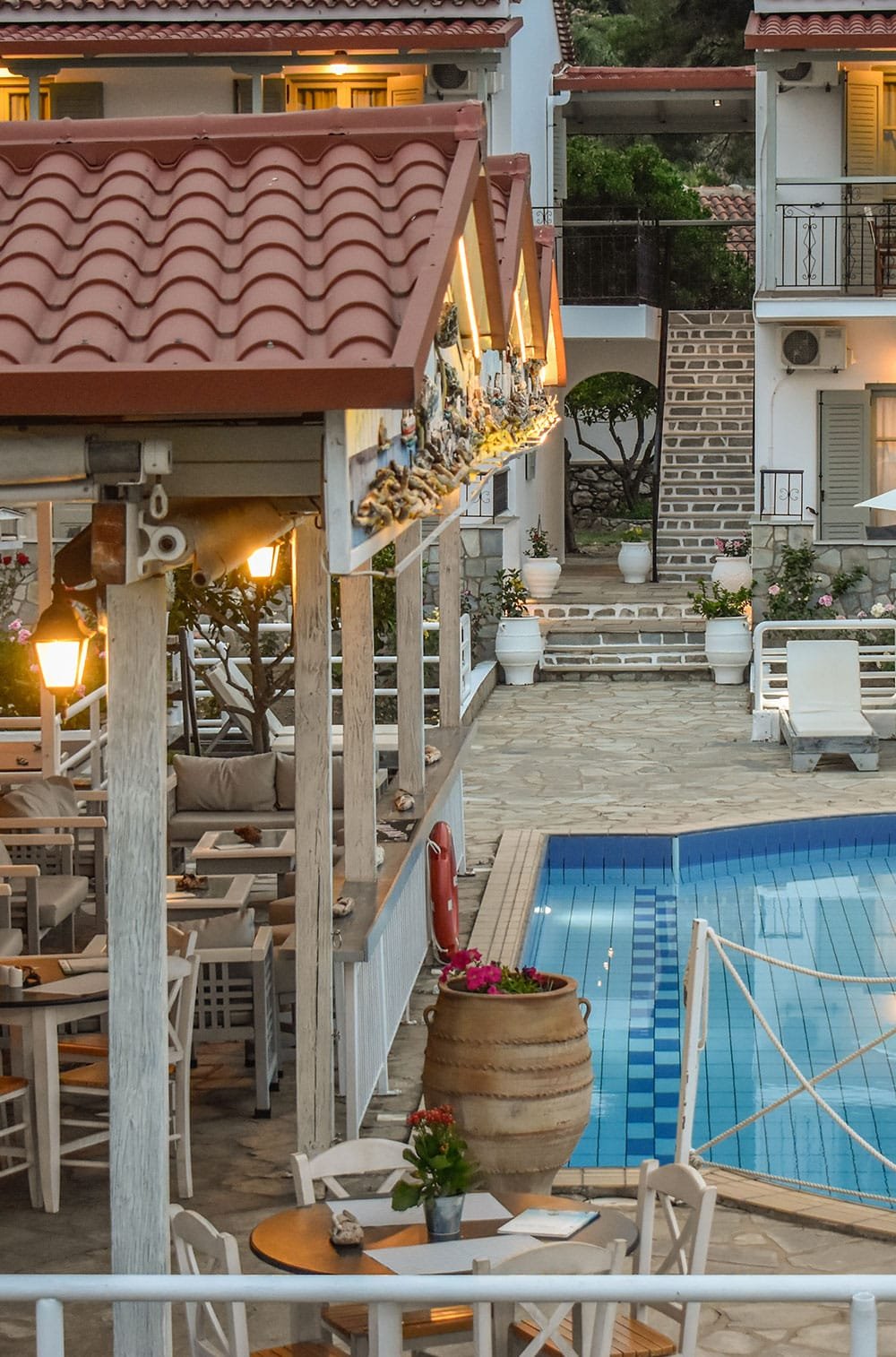 Experience the best Greek night in Skiathos at Villa Rosa! From our Troulos pool bar with sunbeds to an authentic Greek taverna featuring live music, authentic Greek food, and traditional dancing. Book your table for a legendary evening in Troulos.