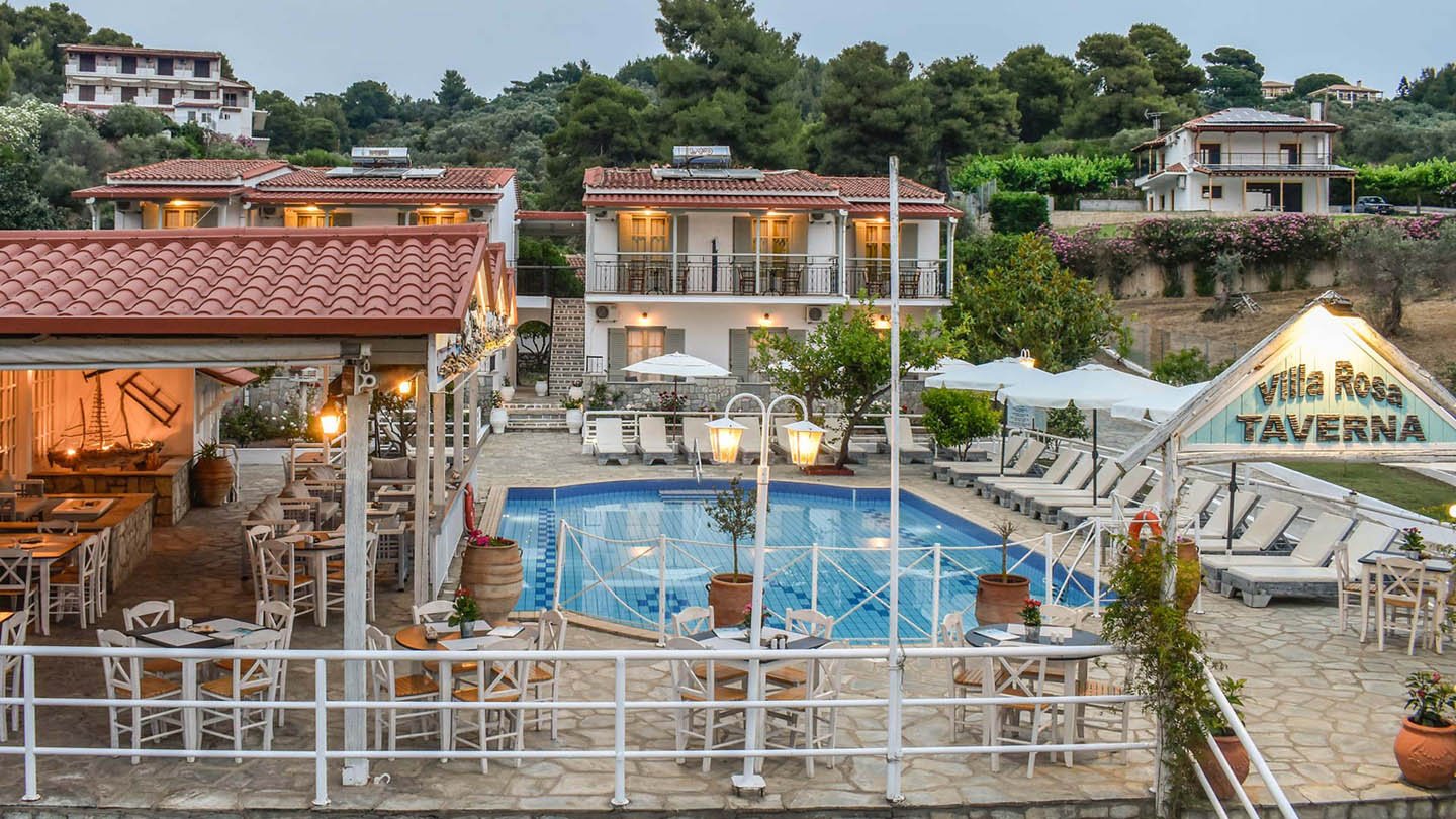 Experience the best Greek night in Skiathos at Villa Rosa! From our Troulos pool bar with sunbeds to an authentic Greek taverna featuring live music, authentic Greek food, and traditional dancing. Book your table for a legendary evening in Troulos.